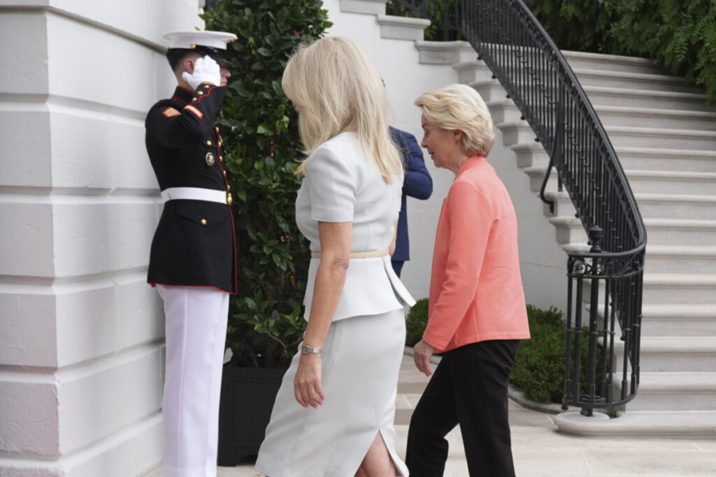 Monica Crowley, White House chief of protocol, left, walks with European Commission President Ursula von der Leyen upon arriving to meet with President Donald Trump and Ukraine's President Volodymyr Zelenskyy, Monday, Aug. 18, 2025, at the South Portico of the White House in Washington. (AP Photo/Jacquelyn Martin)