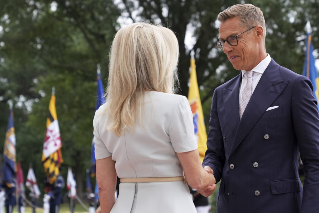 Monica Crowley, White House chief of protocol, left, greets Finland's President Alexander Stubb upon arriving to meet with President Donald Trump and Ukraine's President Volodymyr Zelenskyy, Monday, Aug. 18, 2025, at the South Portico of the White House in Washington. (AP Photo/Jacquelyn Martin)