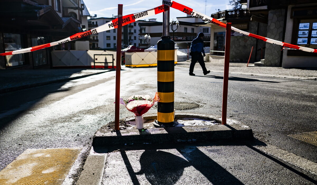 epa12620594 Flowers are left as a memorial near the area where a fire broke out at the Le Constellation bar and lounge following an explosion in the early hours of New Year's Eve, in Crans-Montana, Switzerland, 01 January 2026. According to the police, several dozen people lost their lives in the fire and around one hundred people were also reported injured. EPA/JEAN-CHRISTOPHE BOTT